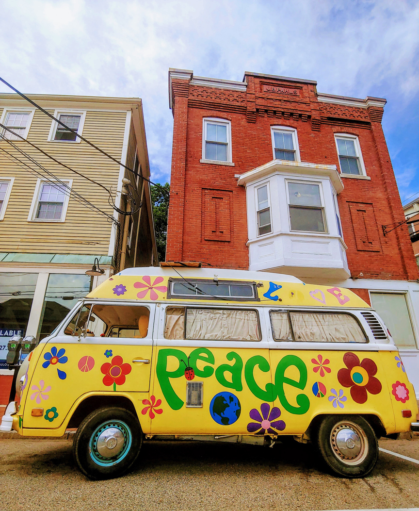 vw bus with peace and flowers